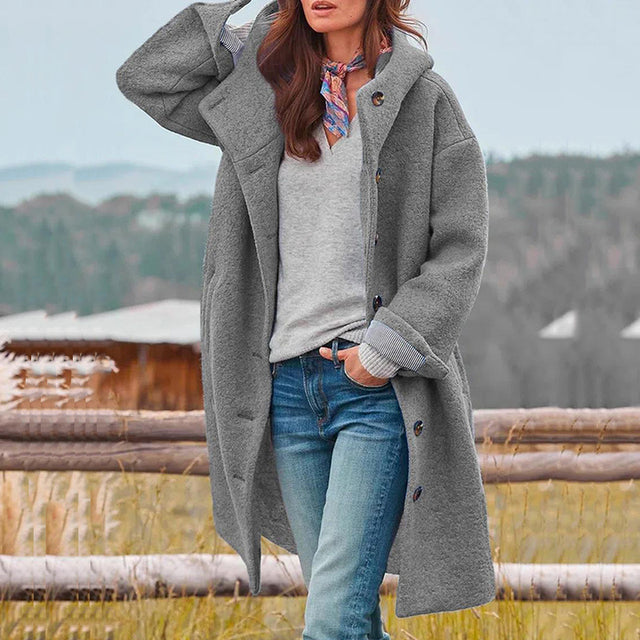Women's long hooded button-front coat with side pockets and long sleeves