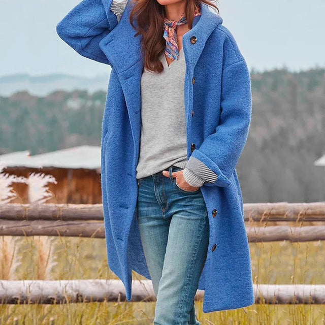 Women's long hooded button-front coat with side pockets and long sleeves