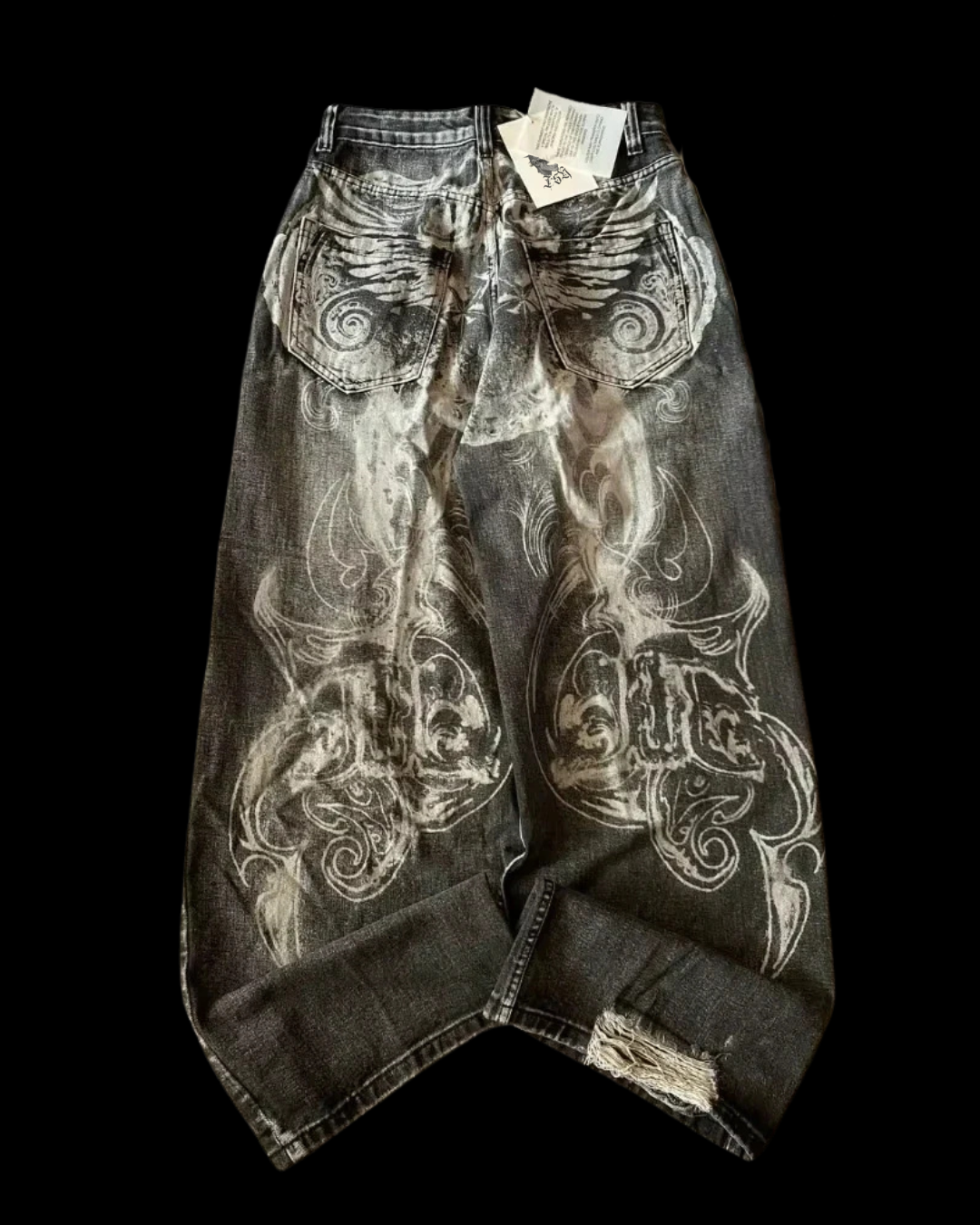 Black wide-leg jeans with ornate abstract graphics and distressed hems