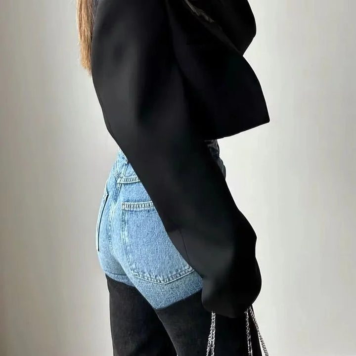 Women's high-waisted two-tone jeans with light blue upper panels and black straight legs