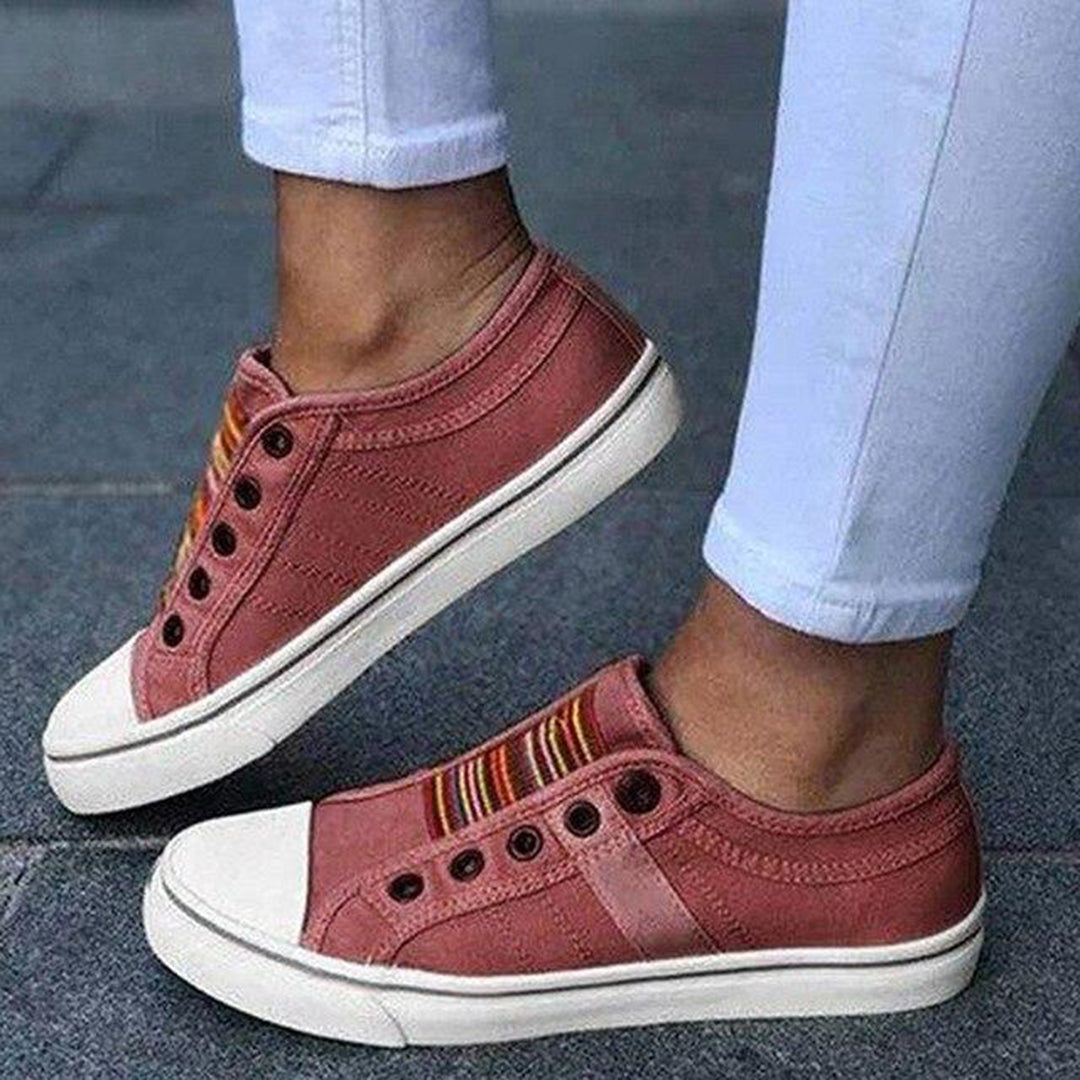 Women's low-top slip-on sneakers with rounded toes, elastic striped gussets and flat white soles