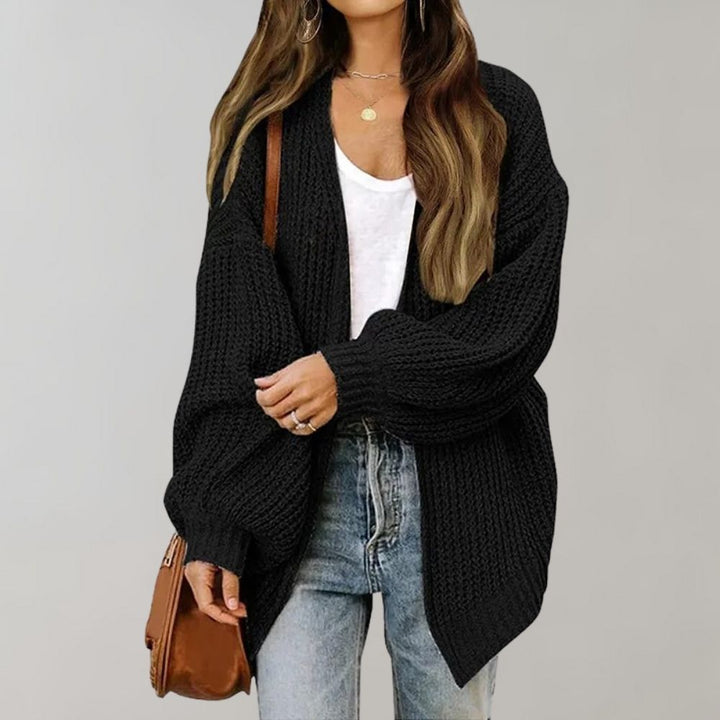 Women's open front textured knit cardigan with long sleeves and curved hem