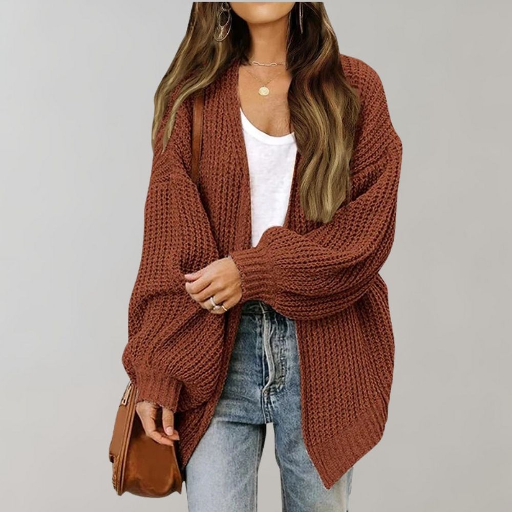 Women's open front textured knit cardigan with long sleeves and curved hem