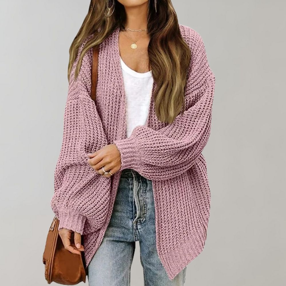 Women's open front textured knit cardigan with long sleeves and curved hem