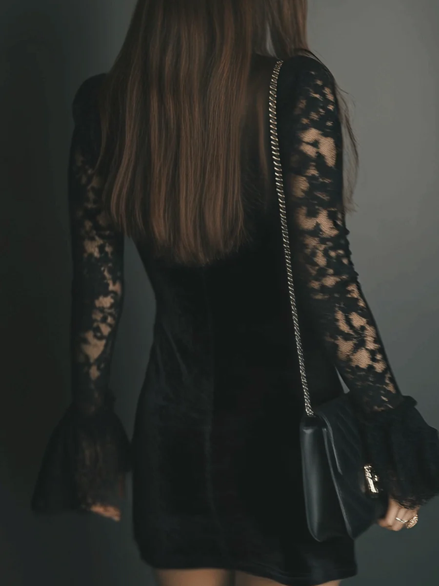Women's black velvet mini dress with lace V-neckline and long sleeves