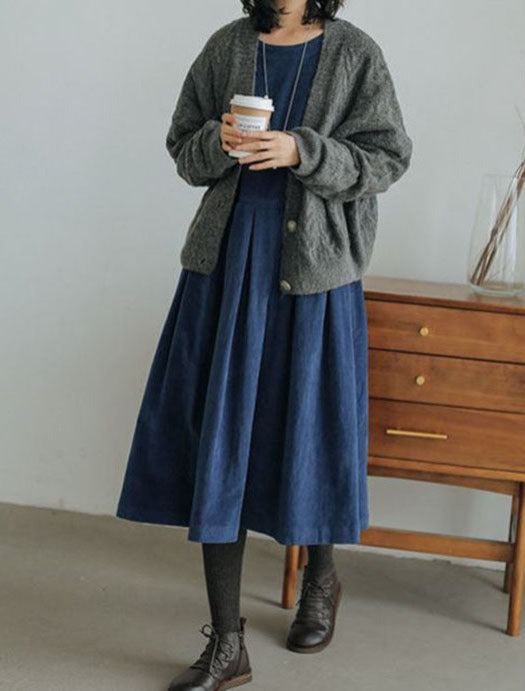 Women's long-sleeve pleated maxi dress with a round neckline and full skirt