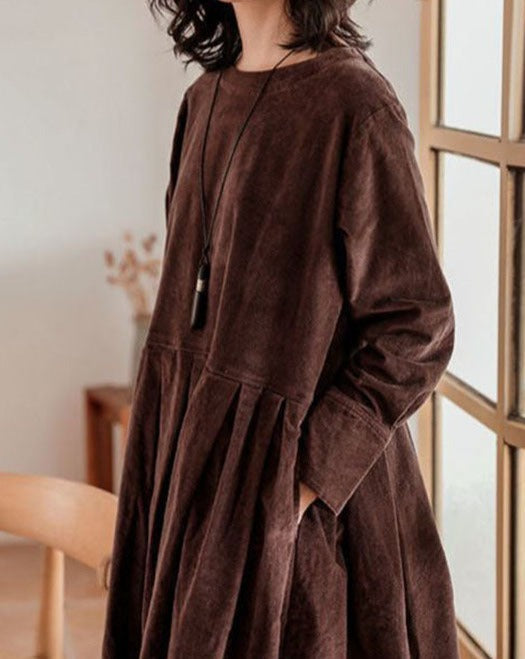 Women's long-sleeve pleated maxi dress with a round neckline and full skirt