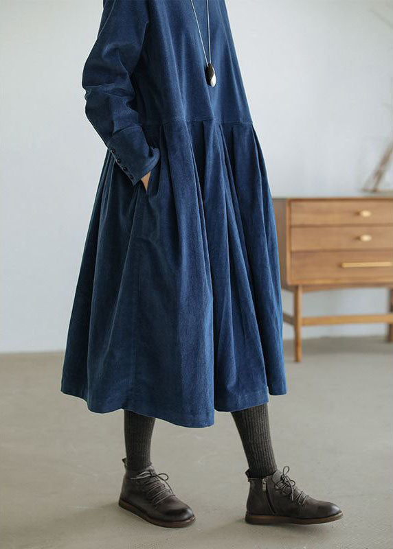 Women's long-sleeve pleated maxi dress with a round neckline and full skirt