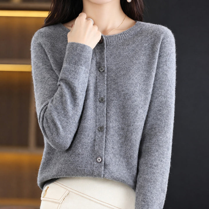 Women's long-sleeve button front cardigan with rounded neckline and ribbed trims