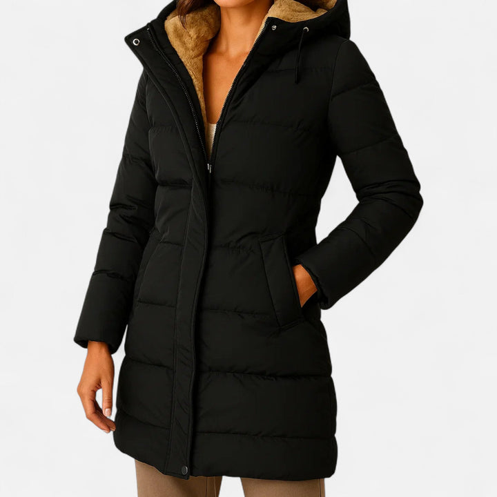 Women's hooded quilted puffer jacket with long sleeves and mid-thigh length