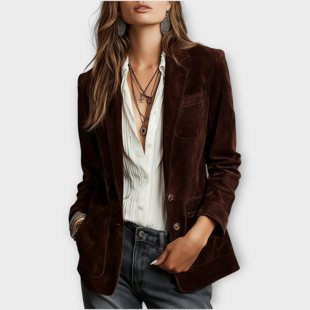 Women's vintage brown blazer with notched lapels, long sleeves, buttons and multiple pockets