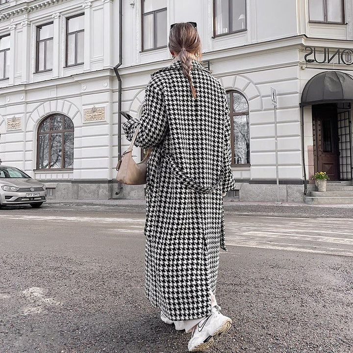 Women's black and white houndstooth long coat with lapel collar and button front