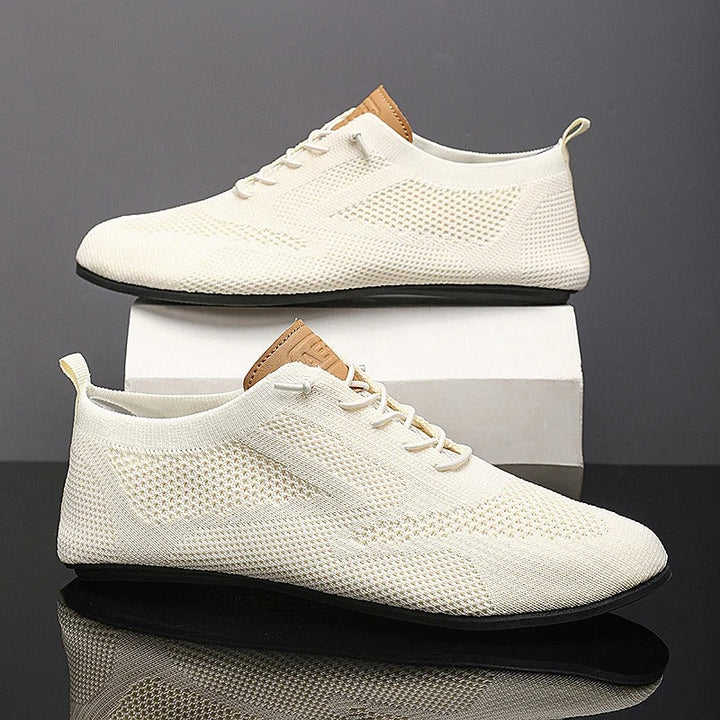 Knit lace-up shoes with round toes, flat soles and heel pull tabs