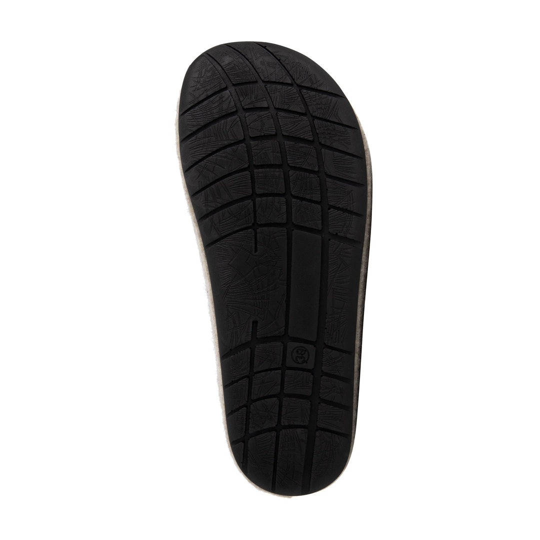 Beige closed-toe slip-on house slippers with black flat soles