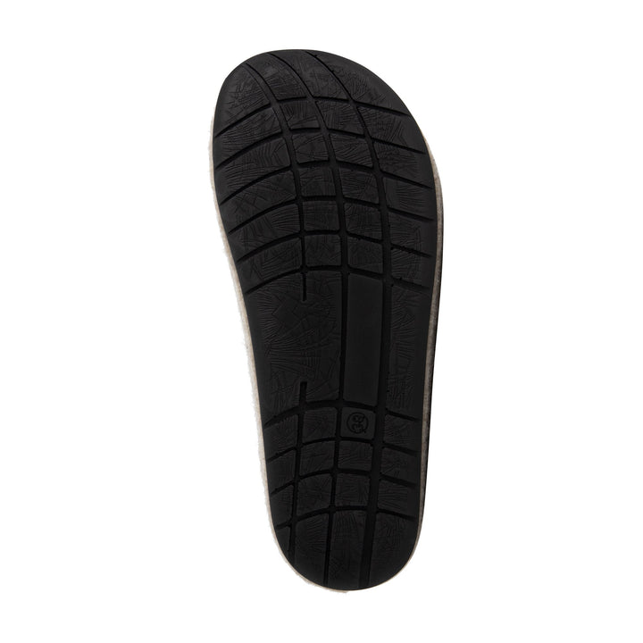 Beige closed-toe slip-on house slippers with black flat soles