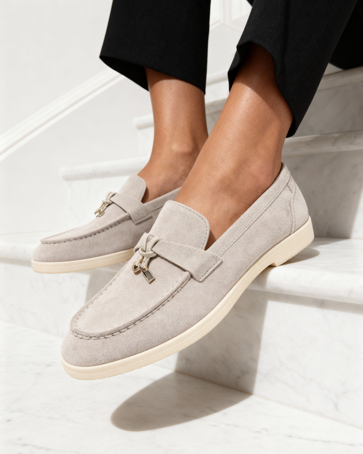 Women's slip-on loafers with penny straps and metal trim