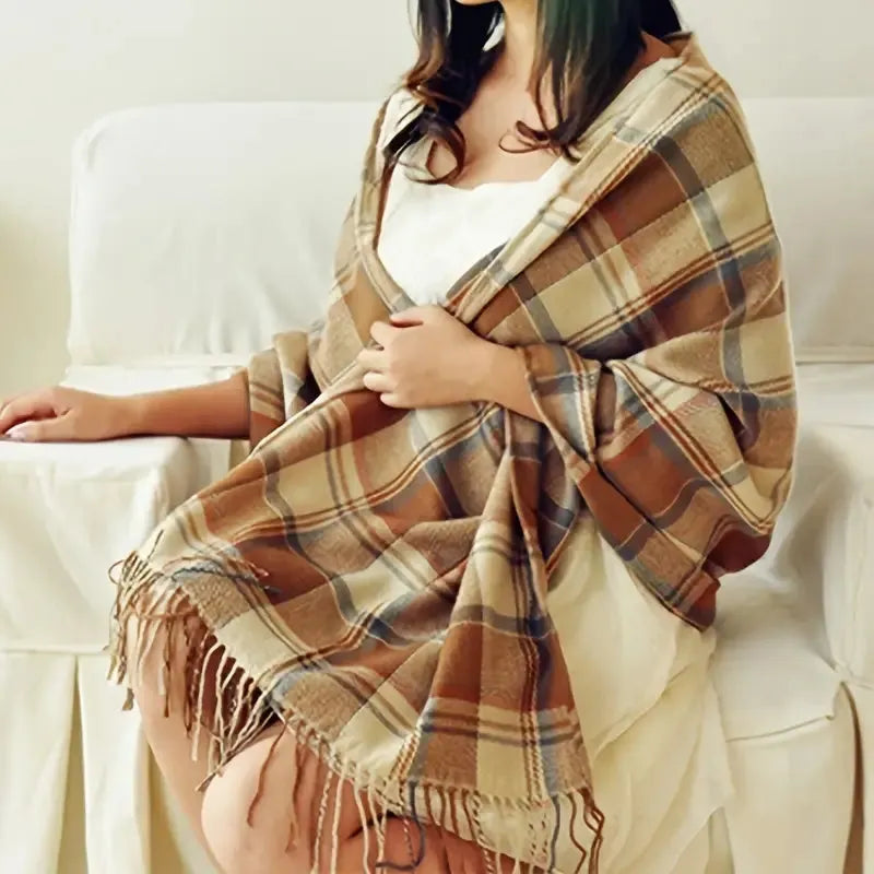 Women's checked fringe scarf worn as a draped shoulder wrap