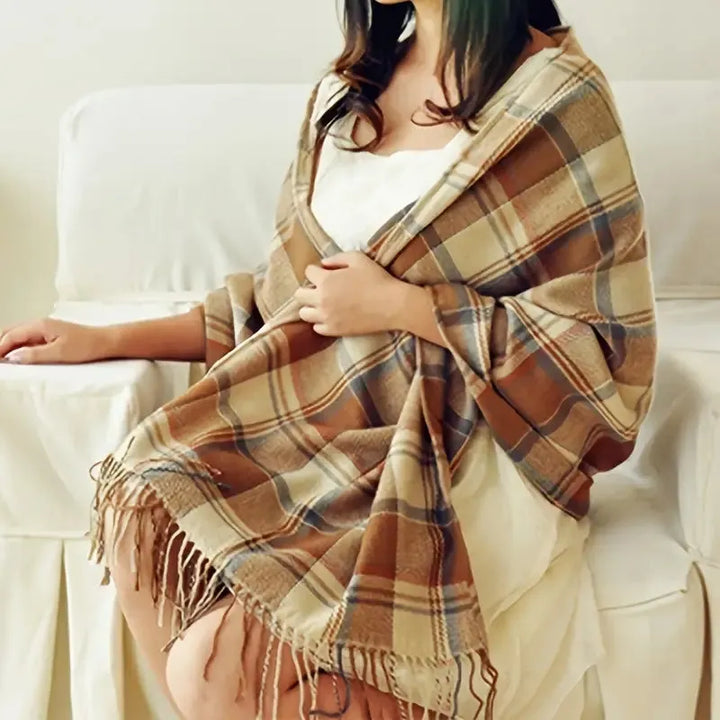 Women's checked fringe scarf worn as a draped shoulder wrap