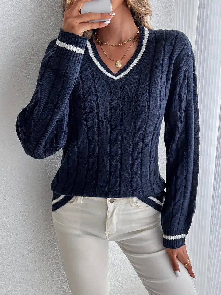 Women's navy cable knit V-neck sweater with white striped trim