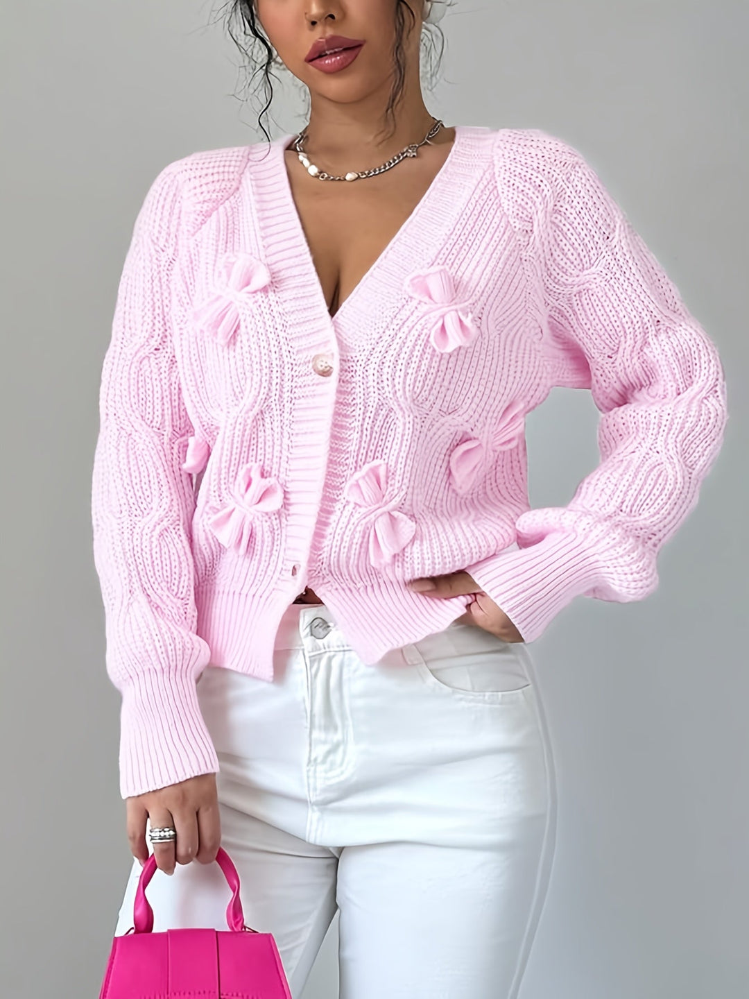 Women's ribbed knit cardigan with bow details, V-neckline and long sleeves