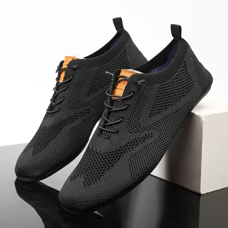 Knit lace-up shoes with round toes, flat soles and heel pull tabs