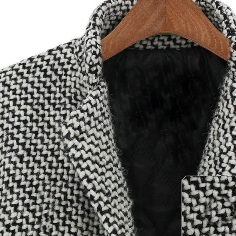 Women's long black and white houndstooth coat with lapels and button front