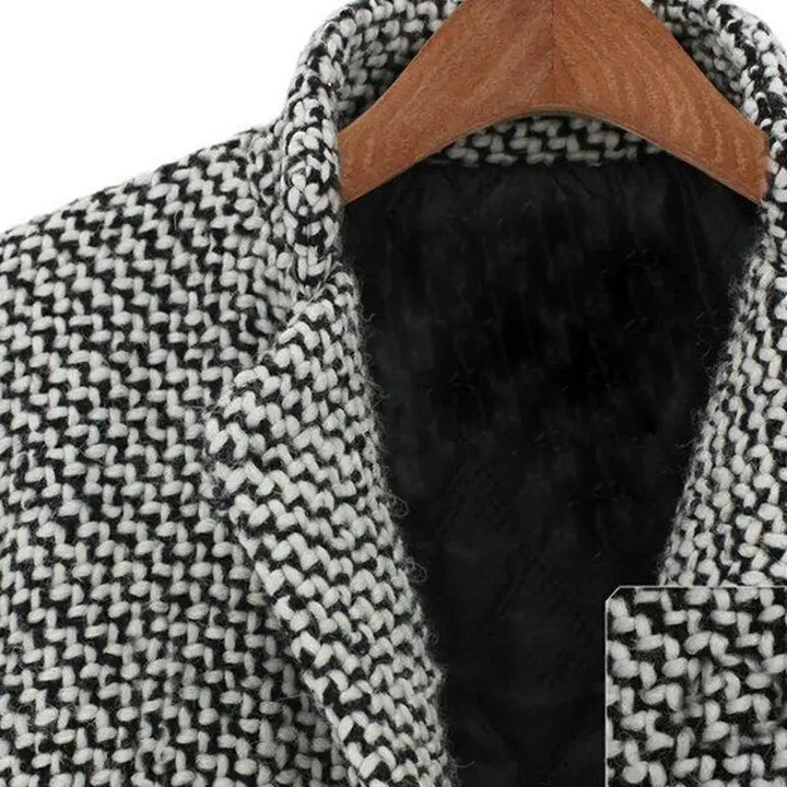 Women's long black and white houndstooth coat with lapels and button front