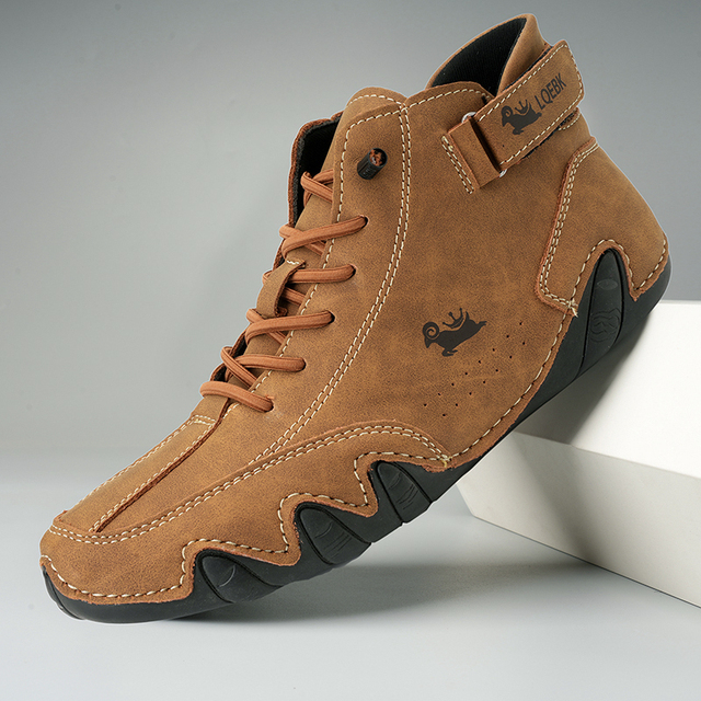 Unisex lace-up ankle boots with hook-and-loop strap and treaded sole