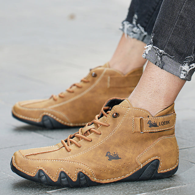 Unisex lace-up ankle boots with hook-and-loop strap and treaded sole