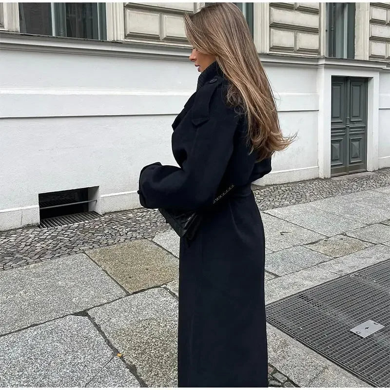 Women's black long double-breasted trench coat with lapels and waist belt