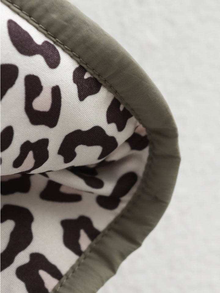 Women's quilted jacket with stand collar, button front and leopard-print cuffs