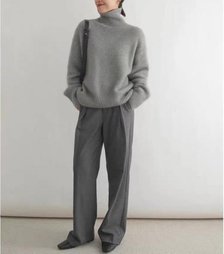 Women's ribbed turtleneck sweater with long sleeves and dropped shoulders