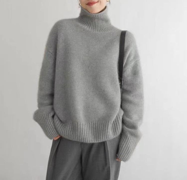 Women's ribbed turtleneck sweater with long sleeves and dropped shoulders