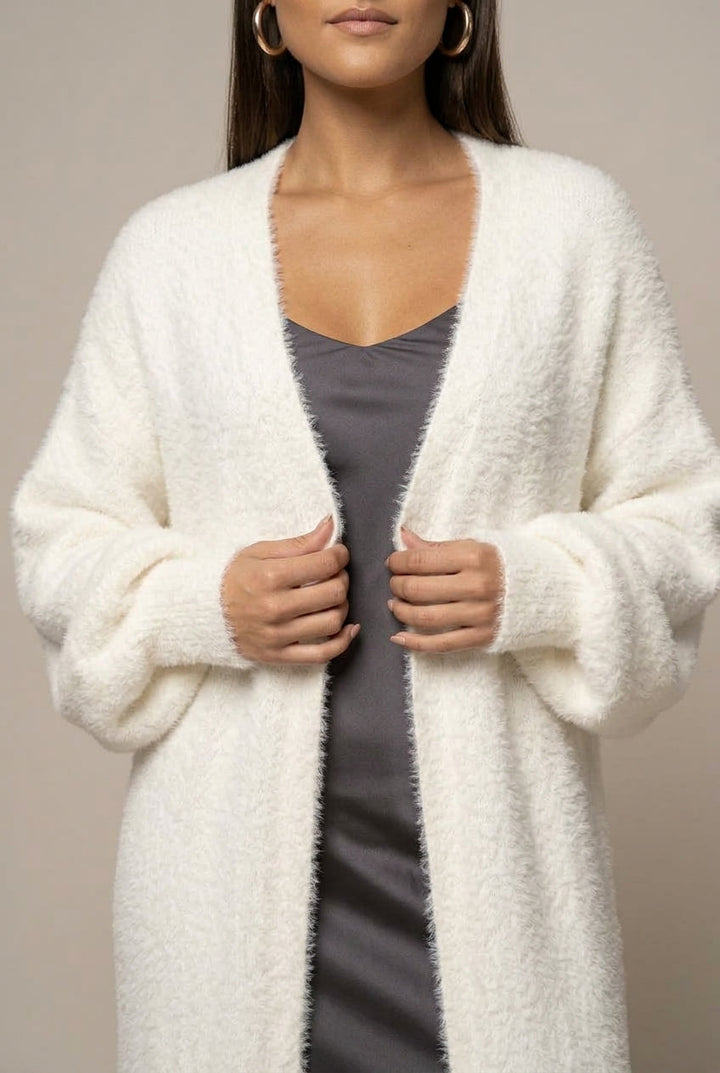 Women's long faux fur cardigan with open front and full-length silhouette