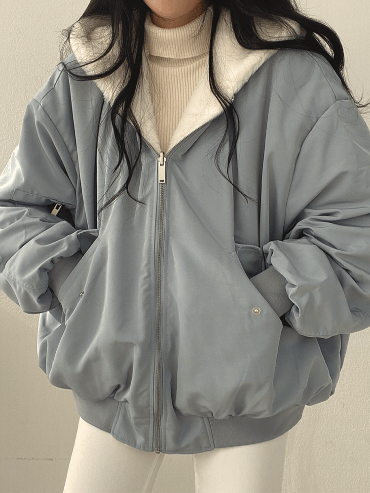 Women's reversible hooded bomber jacket with plush lining and zip front