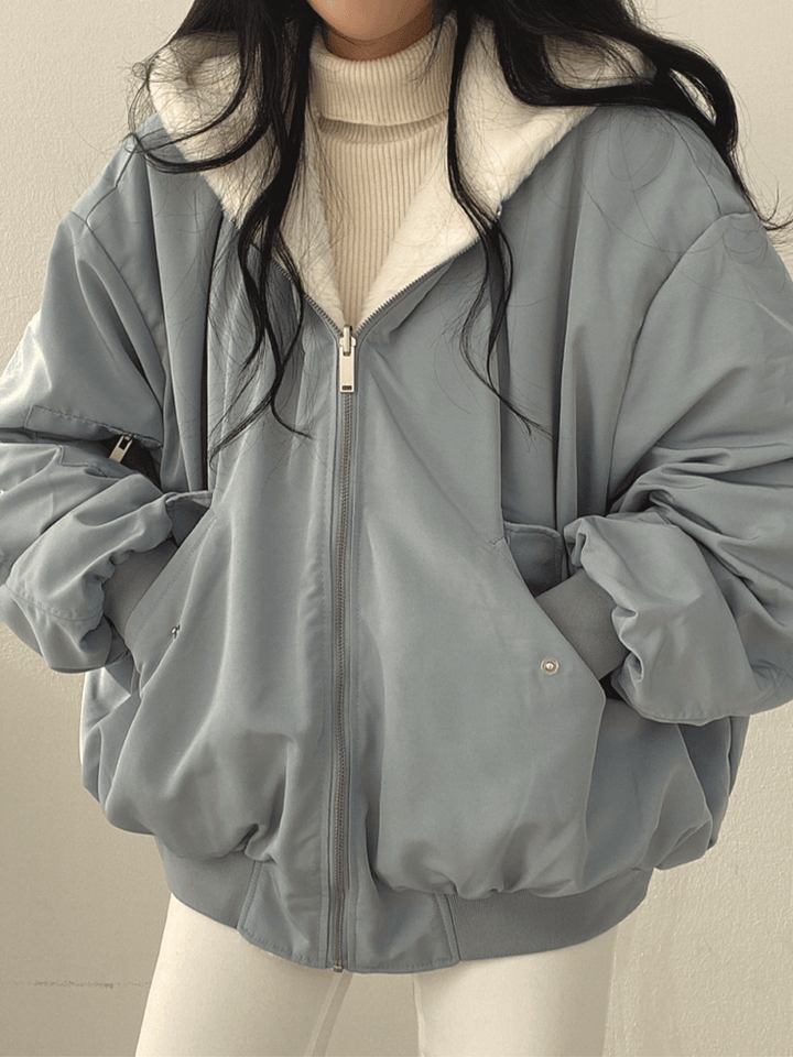 Women's reversible hooded bomber jacket with plush lining and zip front