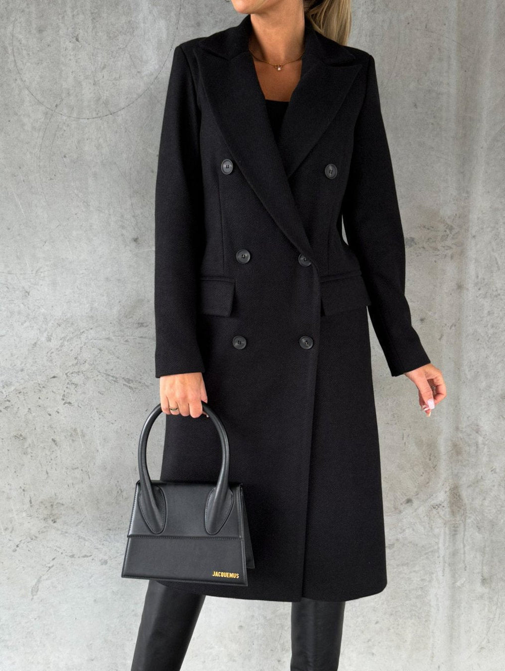 Women's long double-breasted coat with lapel collar and flap pockets