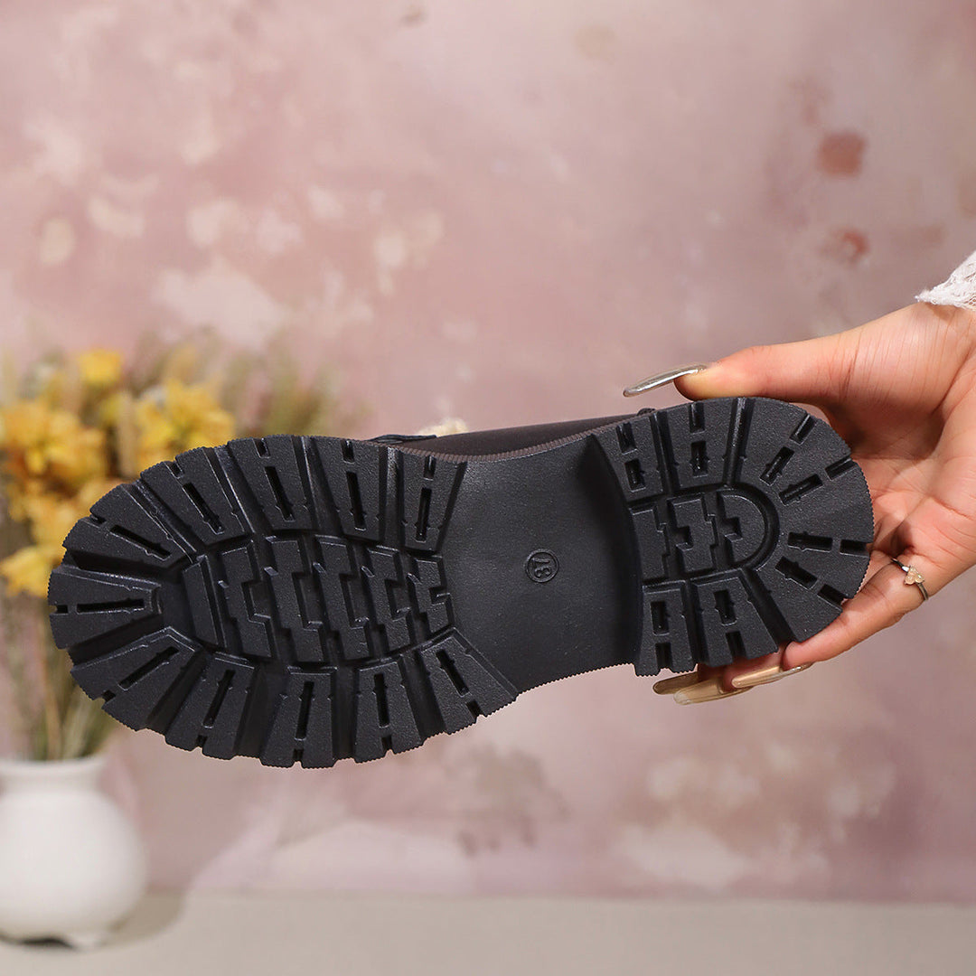 Women's plush lined loafers with decorative upper detail and chunky lug soles