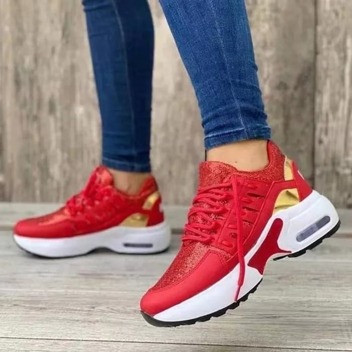Women's low-top lace-up sneakers with layered panels and chunky sculpted soles
