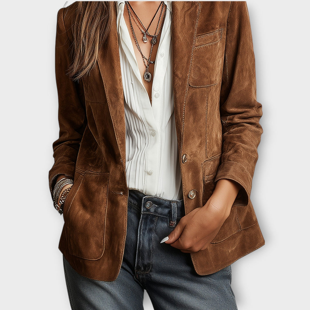 Women's vintage brown blazer with notched lapels, long sleeves, buttons and multiple pockets