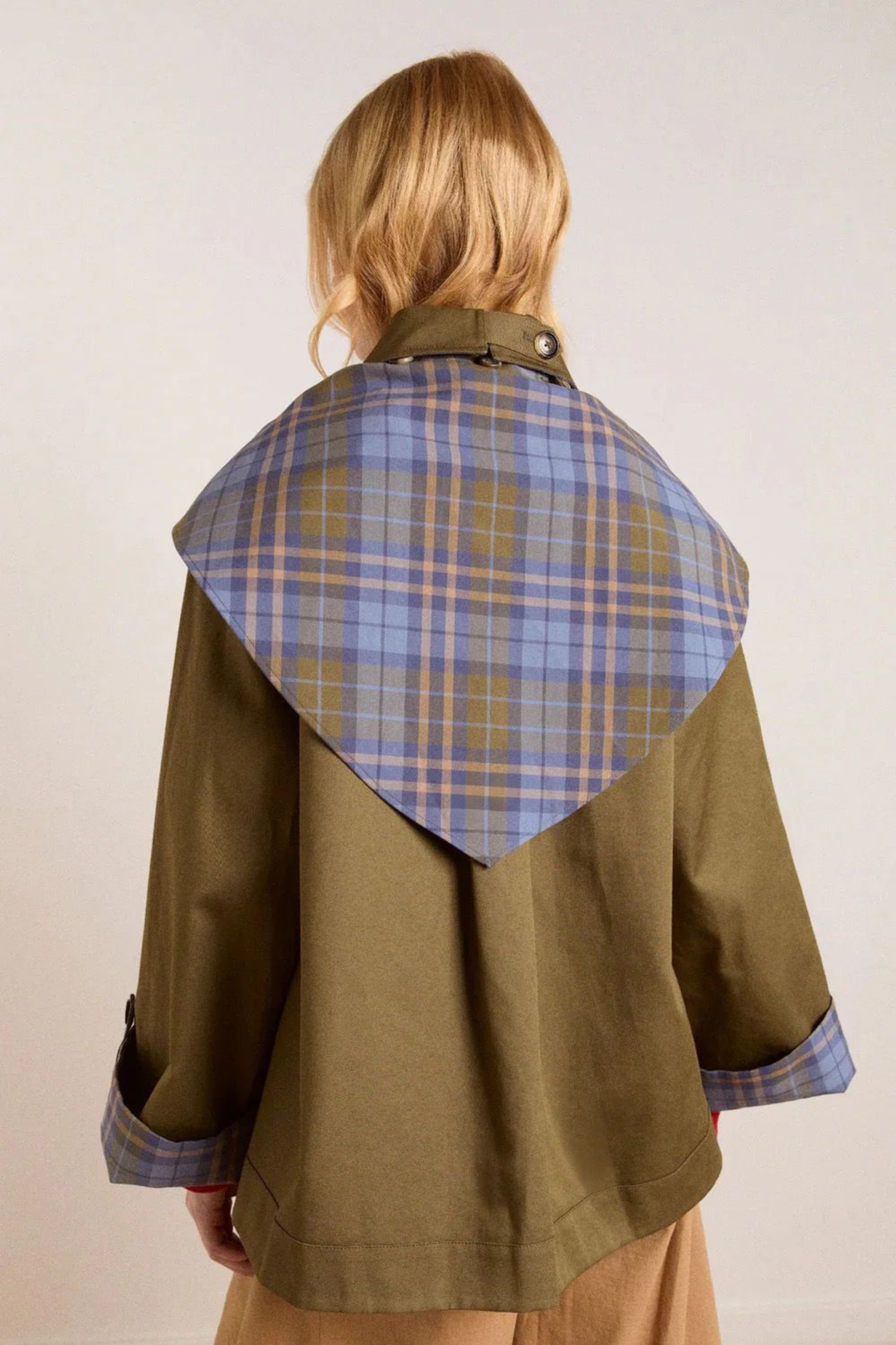 Women's brown jacket with blue plaid trim, raised collar and button front