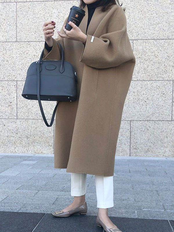 Women's collarless longline coat with open front and wide sleeves