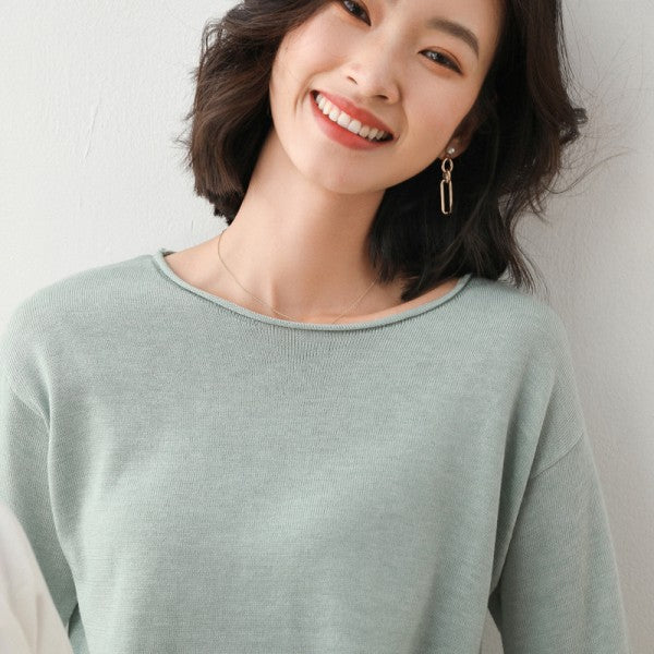 Women's fine knit crew neck sweater with long sleeves and ribbed trims