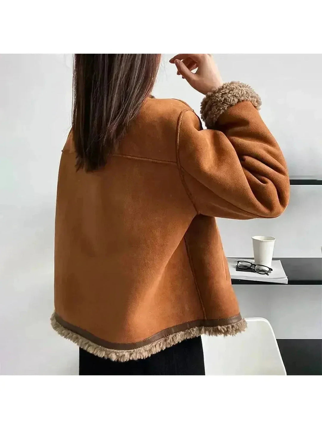 Women's brown jacket with textured trim, round neckline and button front