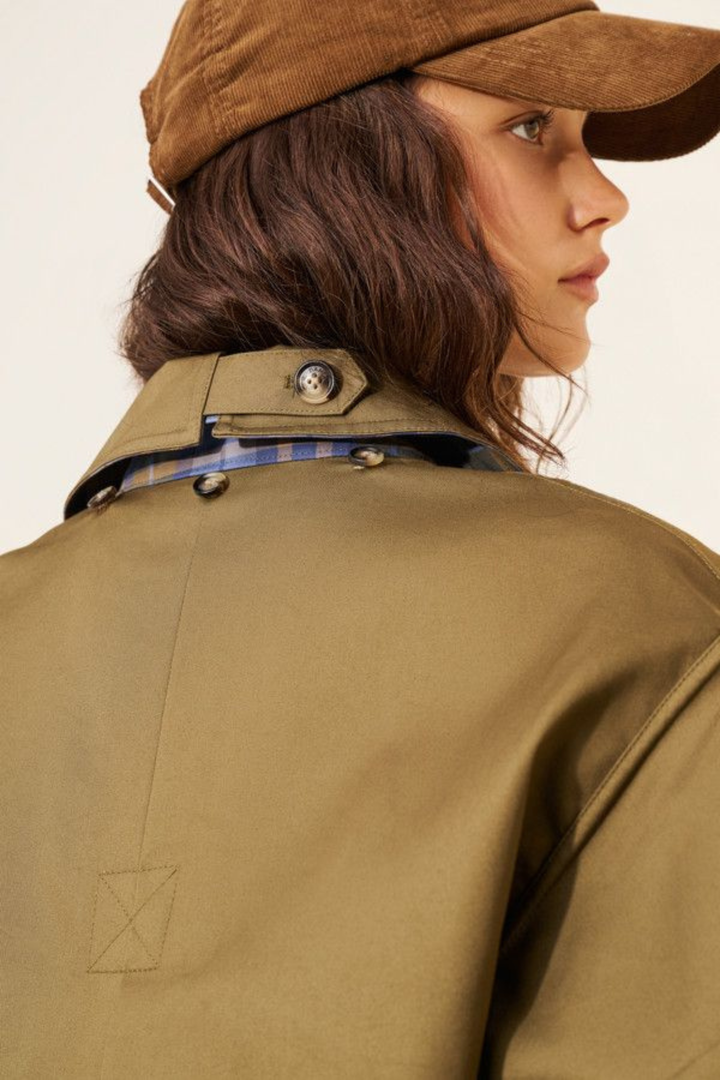 Women's brown jacket with blue plaid trim, raised collar and button front
