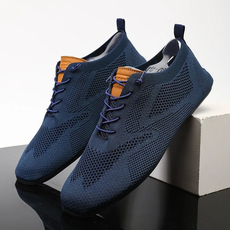 Knit lace-up shoes with round toes, flat soles and heel pull tabs