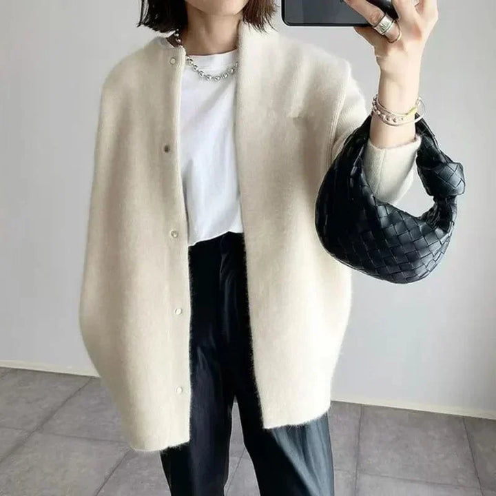 Women's long buttoned knit cardigan jacket with round neckline and long sleeves