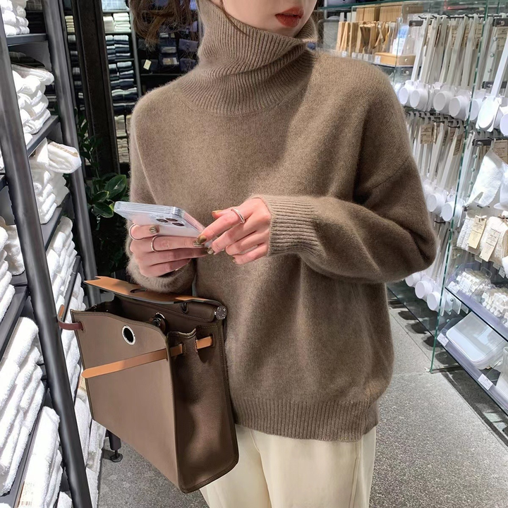 Women's relaxed turtleneck pullover sweater with long sleeves and ribbed trims