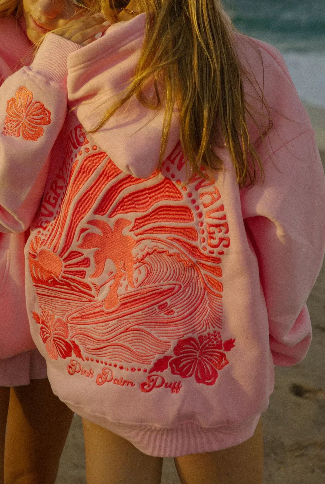 Women's hooded sweatshirt with large illustrated graphic back print and ribbed trims