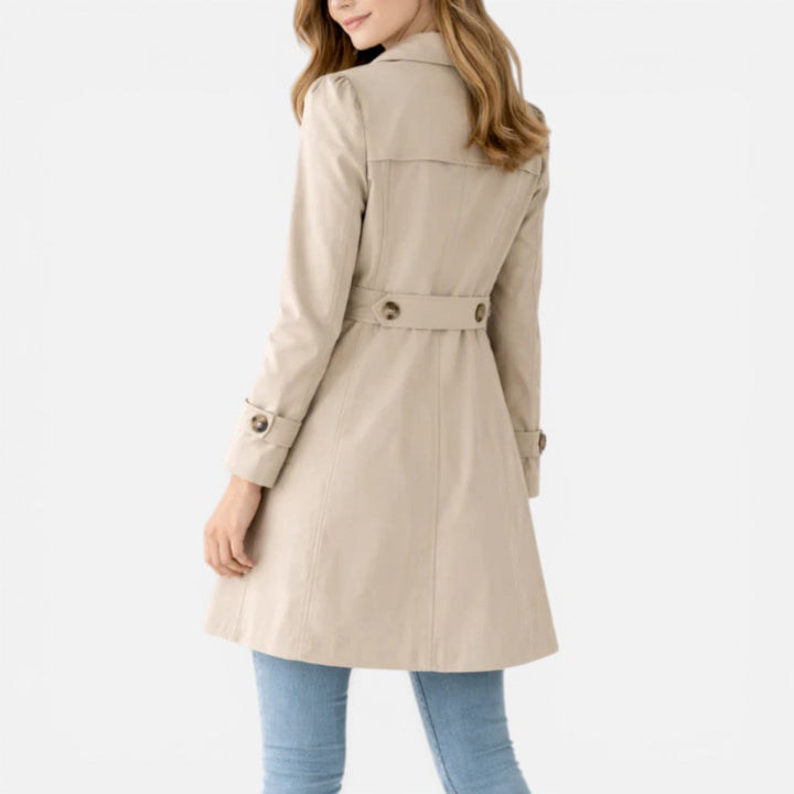 Women's knee-length button front trench coat with notched collar and long sleeves